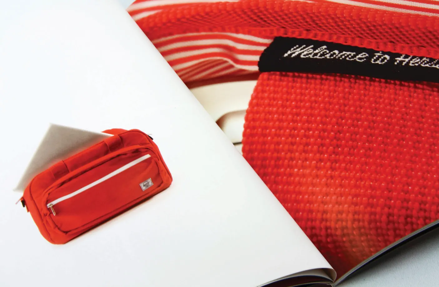 Herschel welcome page and red pouch