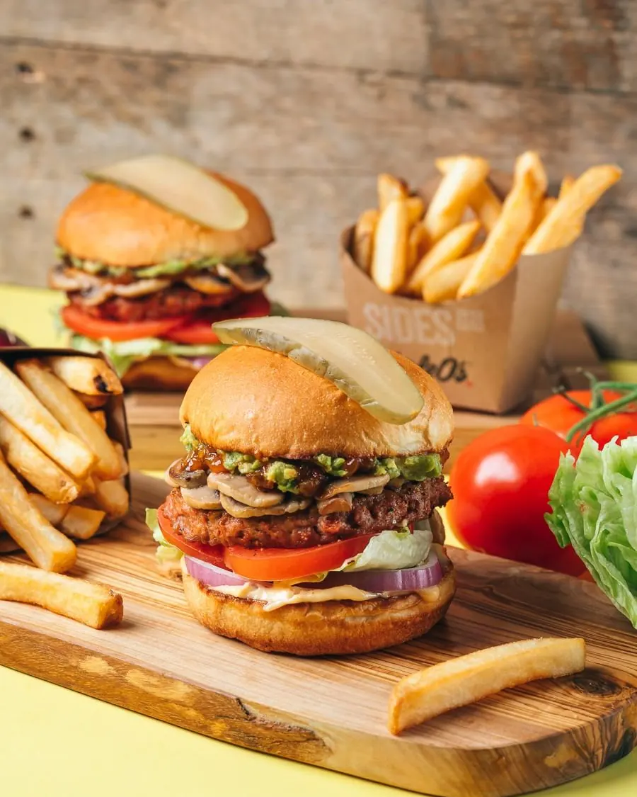 Triple O's burgers and fries on a board