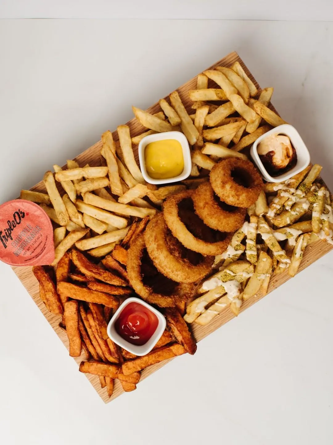 A platter of fries and onion rings