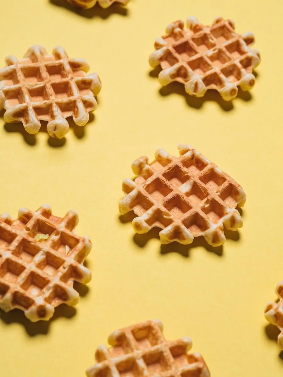 Waffle fries on a yellow background